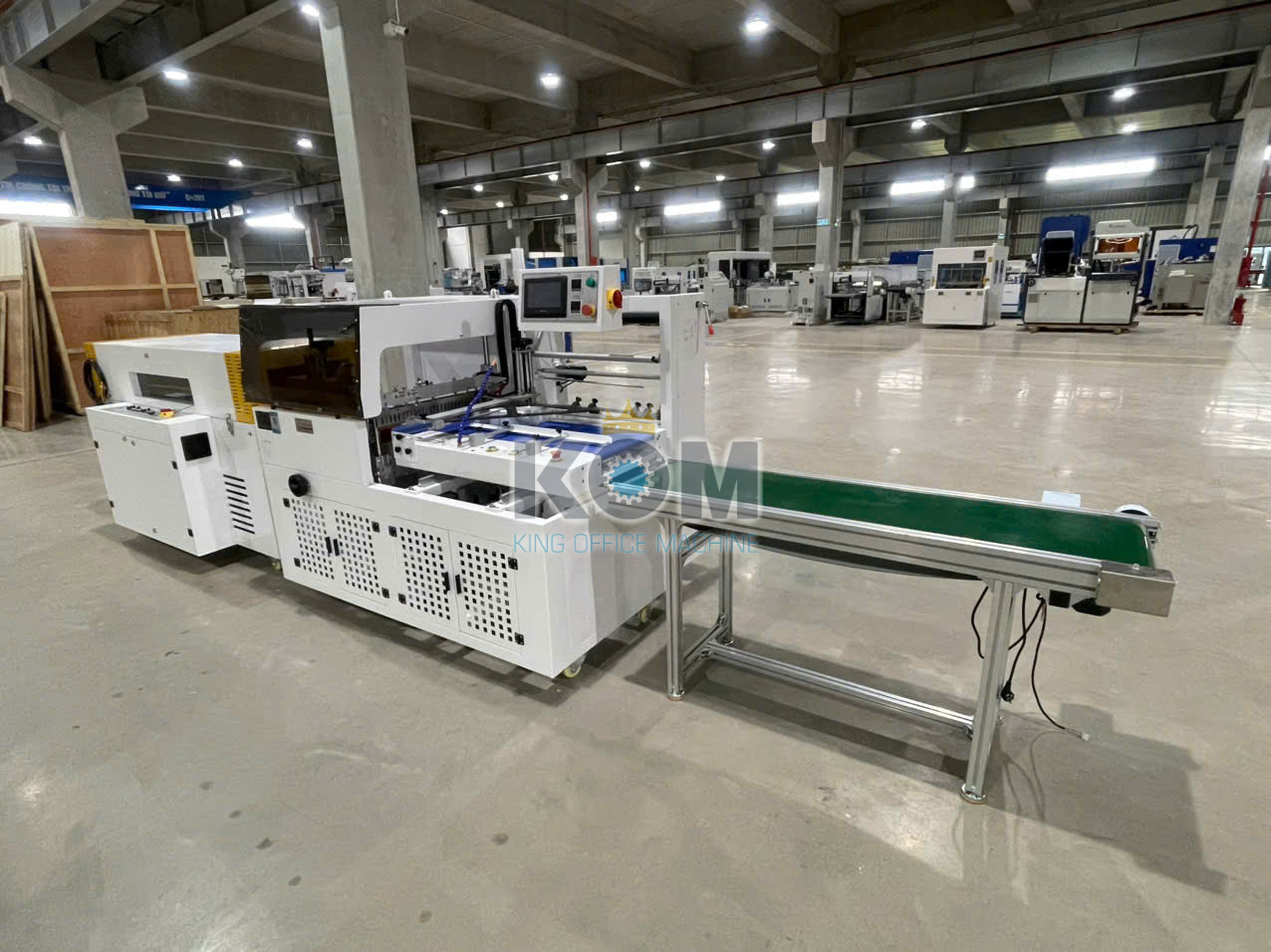 Máy bọc màng co tự động tốc độ cao 2 may boc mang co sach toc do cao DFF